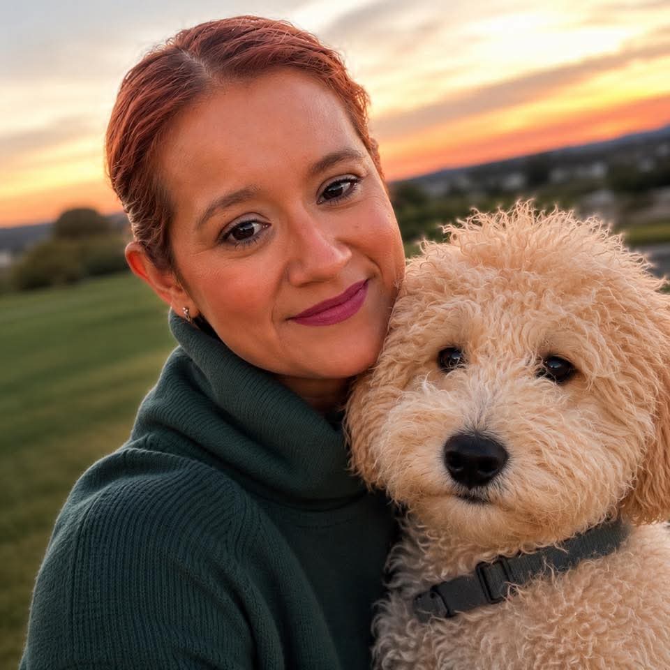 employee posing with dog