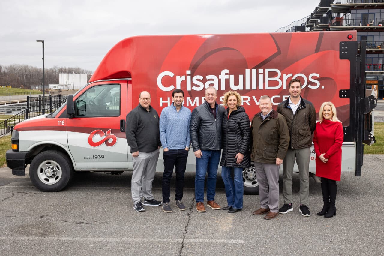 Crisafulli Bros. company in front of van